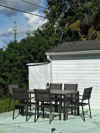 a view of a brick house with a large windows