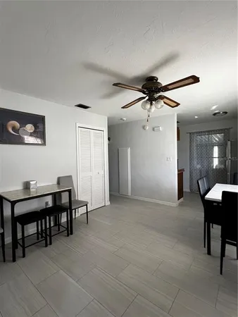 a view of a livingroom with furniture and a chandelier