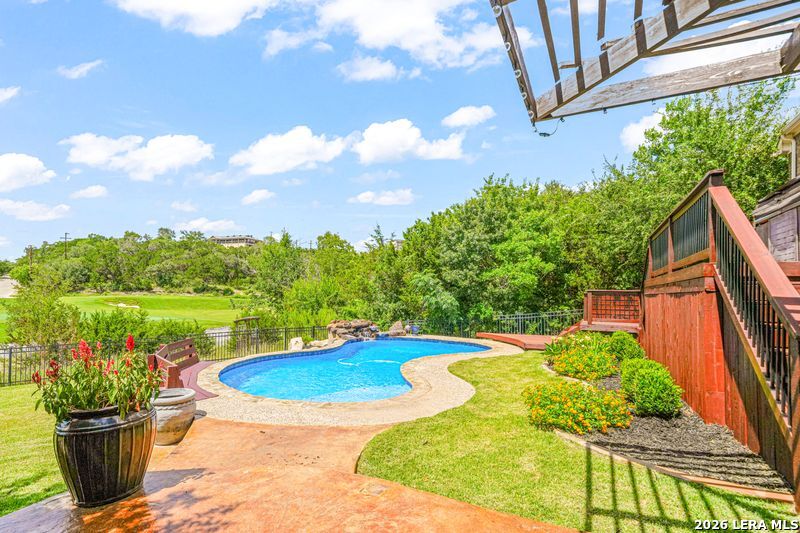 a view of a swimming pool with a patio