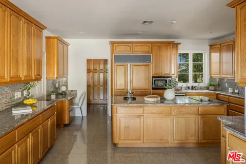 a view of a swimming pool with outdoor seating