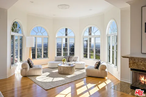a spacious bathroom with sink shower and mirror