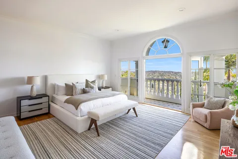 a view of a palm trees front of house