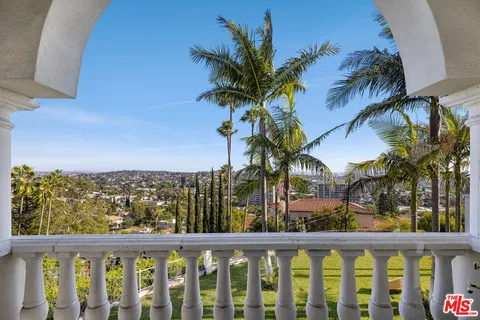 a view of a lake from a balcony
