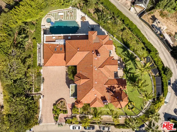 a view of roof deck with table and chairs