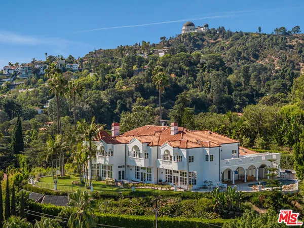 a view of hall way with furniture