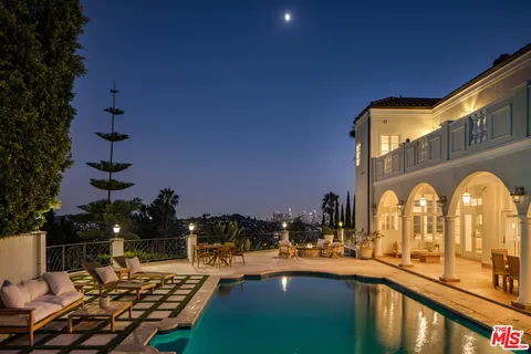 a front view of a house with swimming pool