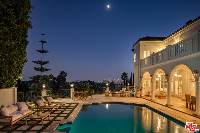 a front view of a house with swimming pool