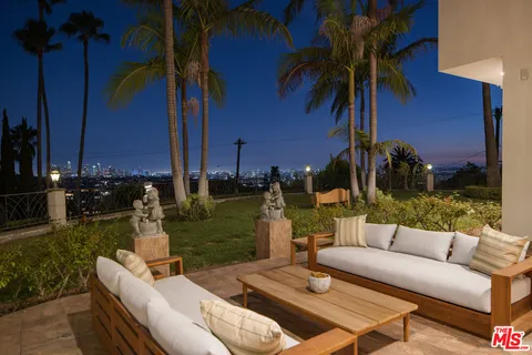 a view of swimming pool with an outdoor space and seating area