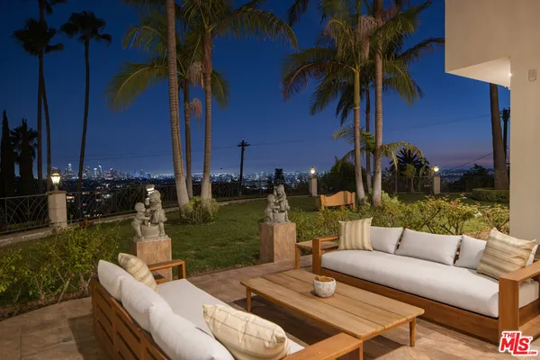 a view of swimming pool with an outdoor space and seating area