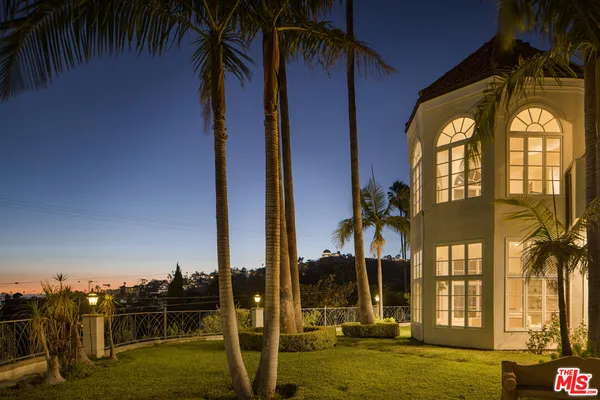 an aerial view of residential houses with city view