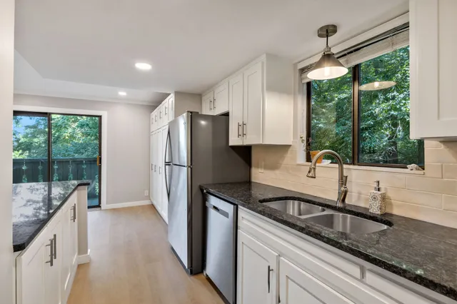 a view of balcony with wooden floor