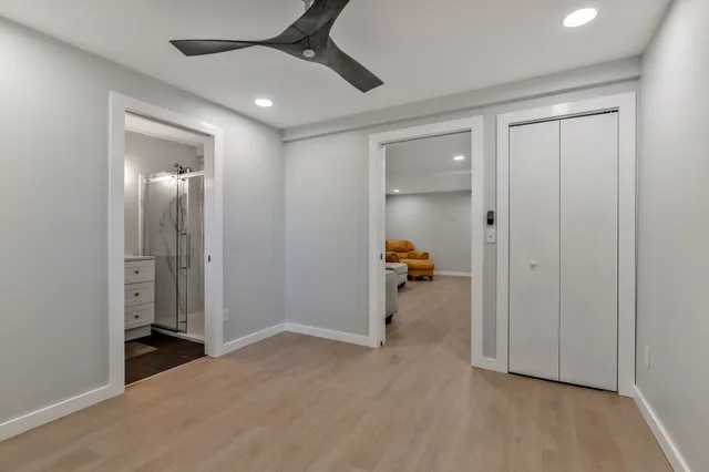 a bathroom with a toilet a sink and a mirror