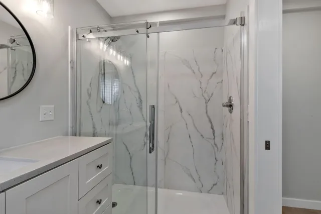 an empty room with entrance and windows