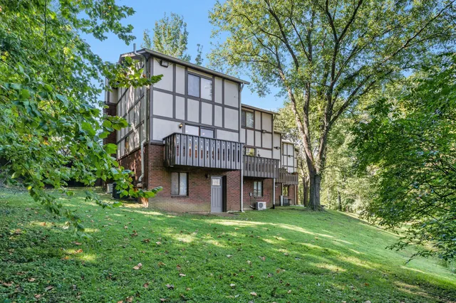 a view of a backyard with chairs