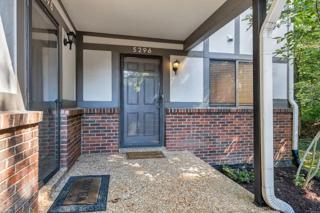 a front view of a house with a garage