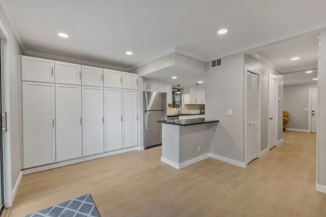a kitchen with a refrigerator a sink and dishwasher