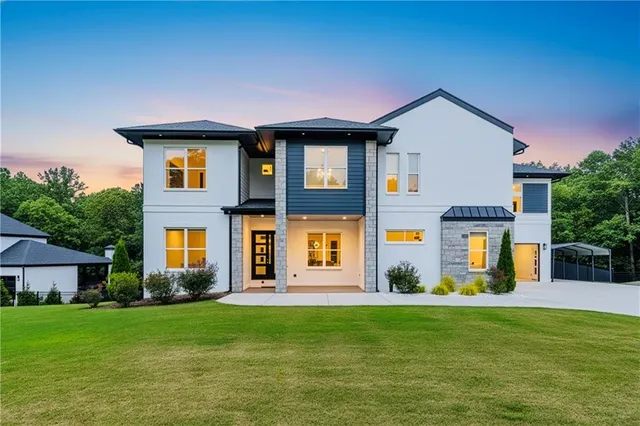 a front view of a house with a yard