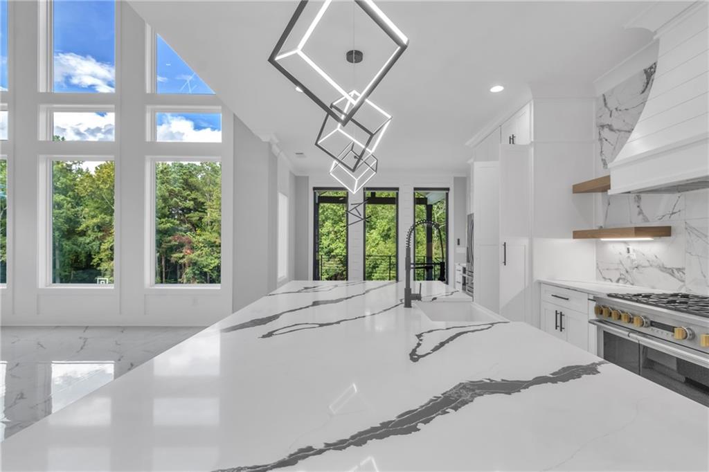 3671 Hamilton Mill Road Buford, GA 30519 - Photo 26 of 111 a spacious bedroom with a large bed and a large window