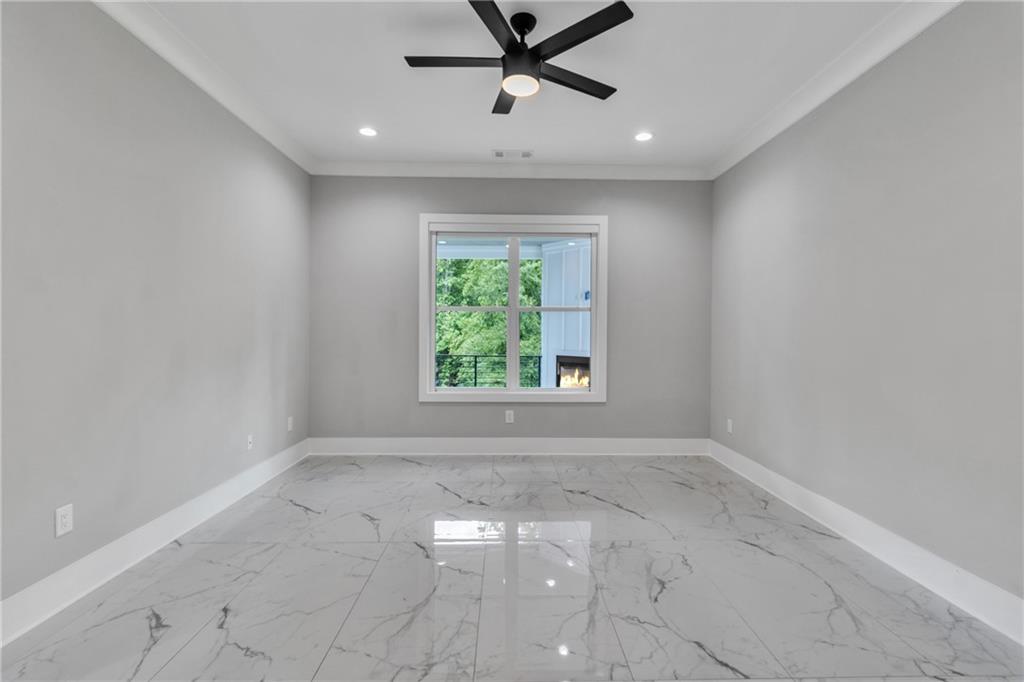 3671 Hamilton Mill Road Buford, GA 30519 - Photo 38 of 111 an empty room with a window and a fan