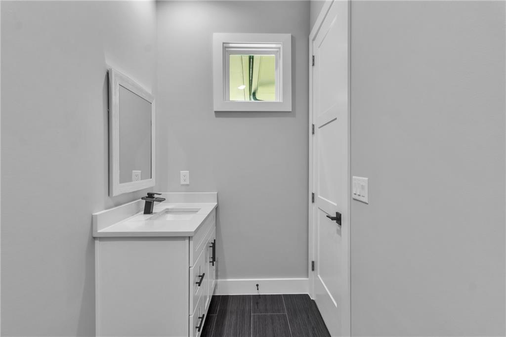 3671 Hamilton Mill Road Buford, GA 30519 - Photo 52 of 111 a bathroom with a sink and a mirror