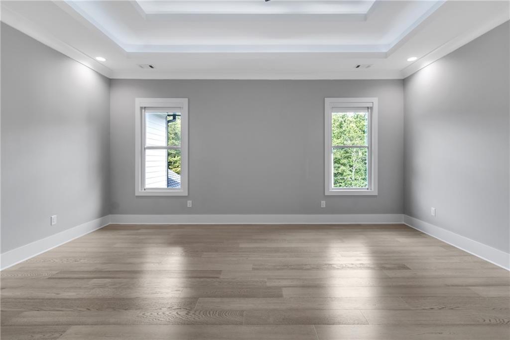 3671 Hamilton Mill Road Buford, GA 30519 - Photo 55 of 111 an empty room with wooden floor and window