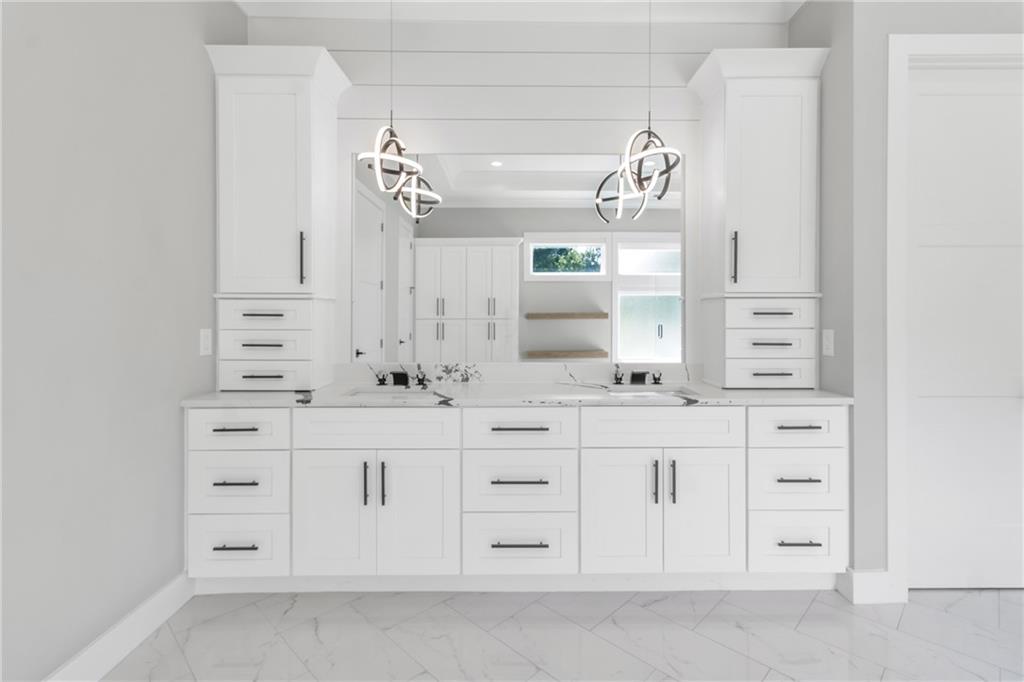 3671 Hamilton Mill Road Buford, GA 30519 - Photo 59 of 111 a bathroom with a sink vanity and mirror