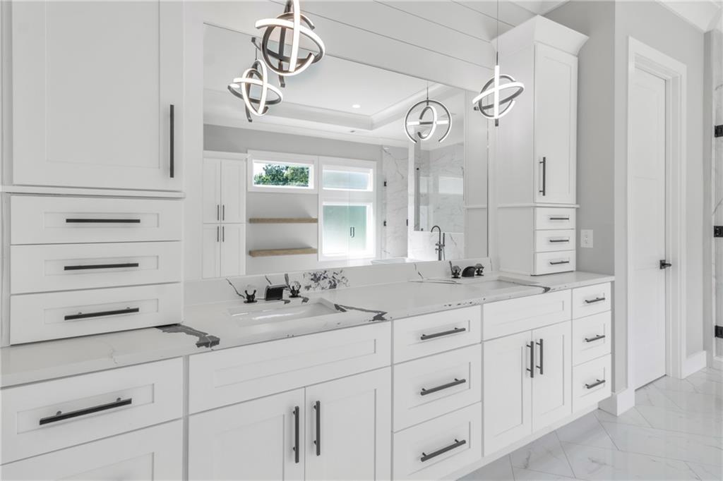 3671 Hamilton Mill Road Buford, GA 30519 - Photo 60 of 111 a bathroom with a sink a vanity and a mirror