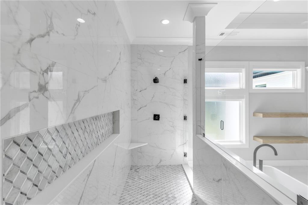 3671 Hamilton Mill Road Buford, GA 30519 - Photo 63 of 111 a bathroom with a bathtub and a sink