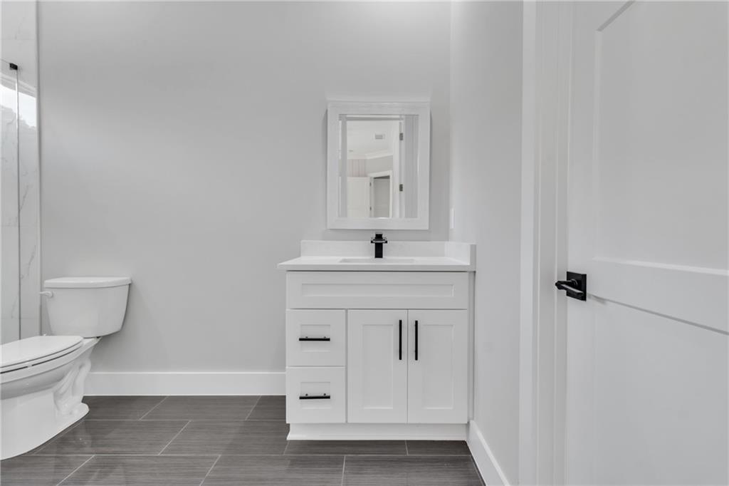 3671 Hamilton Mill Road Buford, GA 30519 - Photo 71 of 111 a bathroom with a sink toilet and vanity