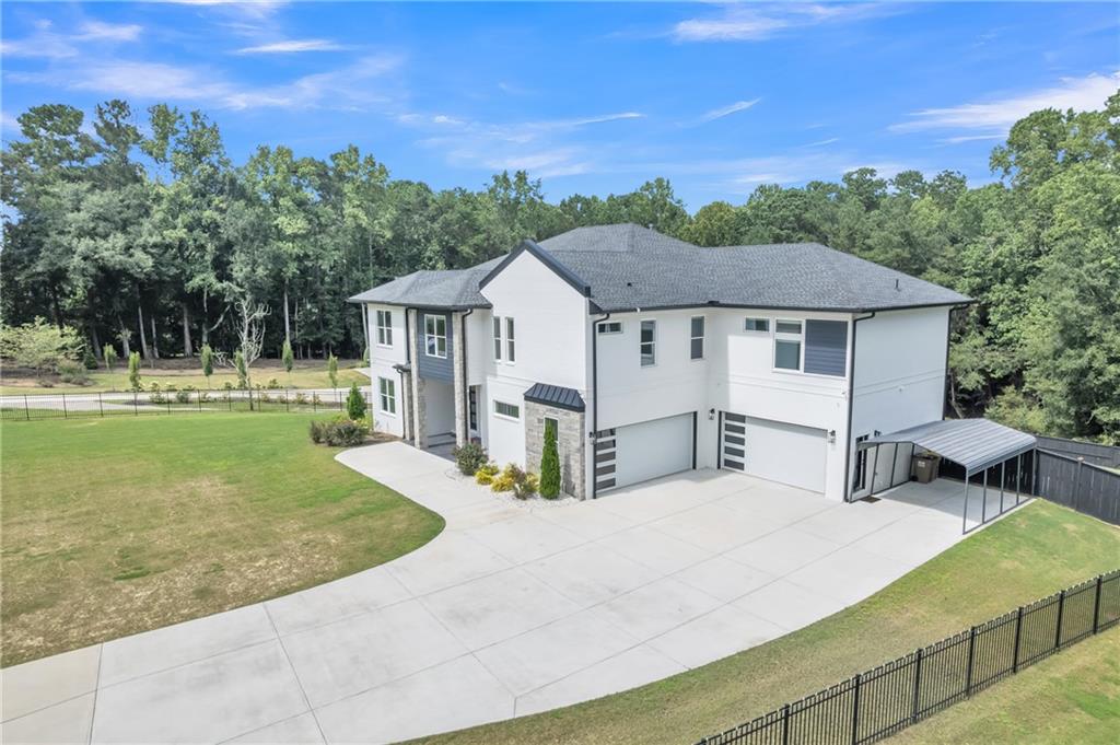 3671 Hamilton Mill Road Buford, GA 30519 - Photo 9 of 111 a view of a house with a yard porch and sitting area