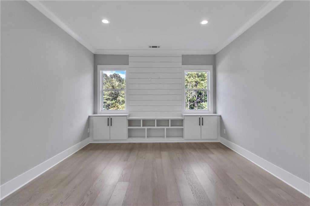3671 Hamilton Mill Road Buford, GA 30519 - Photo 91 of 111 an empty room with wooden floor and windows