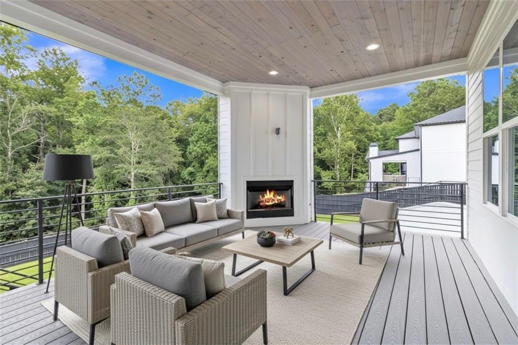 3671 Hamilton Mill Road Buford, GA 30519 - Photo 99 of 111 a living room with furniture fireplace and a large window