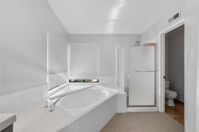 a balcony with wooden floor and fence