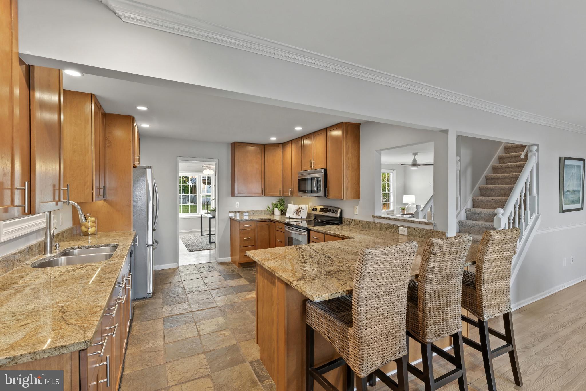 310 Magothy Road Severna Park, MD 21146 - Photo 8 of 38 a large kitchen with a table and chairs