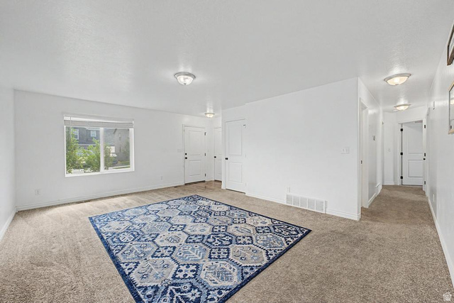 1692 South Windemere Road Santaquin, UT 84655 - Photo 3 of 23 Expansive interior space featuring light-colored carpeting and bright white walls
