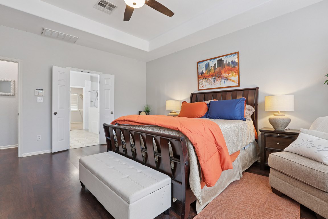 11217 Terrace Meadow Way Manor, TX 78653 - Photo 14 of 33 Bedroom with wood finished floors and a ceiling fan