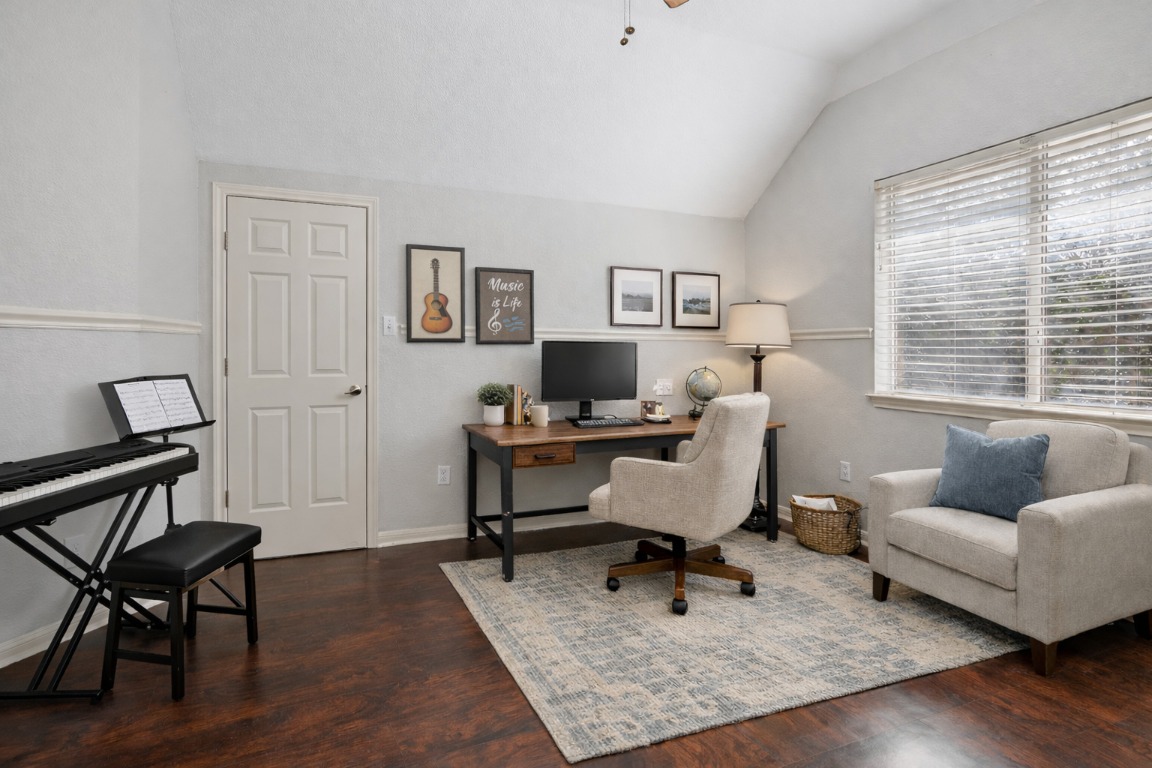 11217 Terrace Meadow Way Manor, TX 78653 - Photo 21 of 33 Office with vaulted ceiling and dark wood-style floors