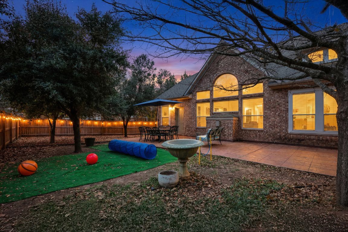 11217 Terrace Meadow Way Manor, TX 78653 - Photo 33 of 33 Fenced backyard featuring a patio area