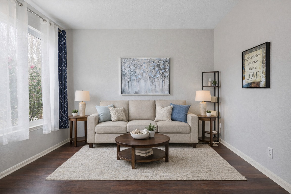 11217 Terrace Meadow Way Manor, TX 78653 - Photo 6 of 33 Living area with dark wood finished floors and baseboards