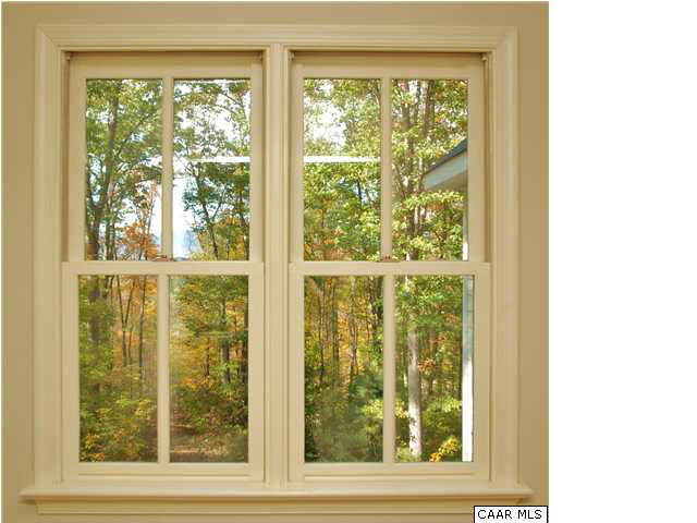 656 Broad Axe Road Charlottesville, VA 22903 - Photo 5 of 9 The architect owner spared no expense with any finishes including hardwood floors, stylish details and custom windows and doors. Notice the views as you look out this second floor hall window.