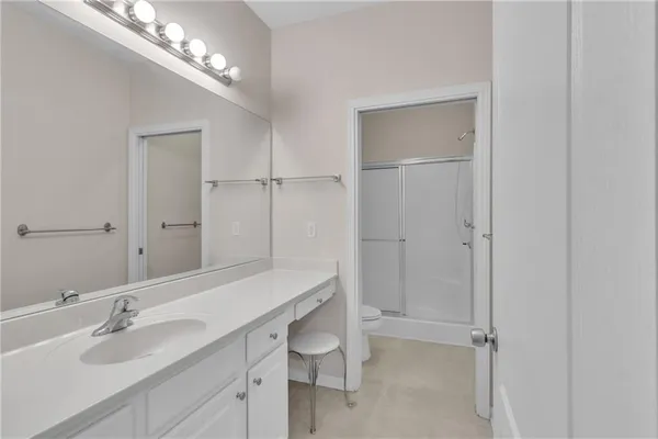 a bathroom with a sink double vanity and a mirror