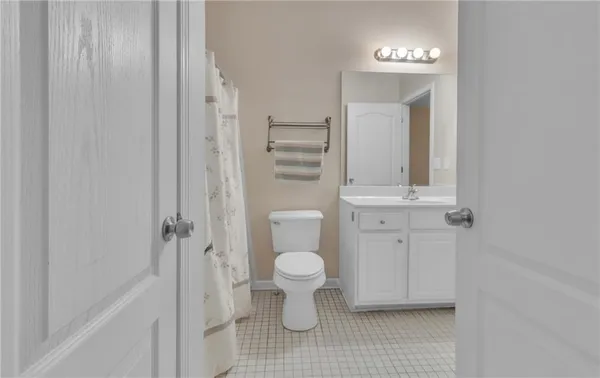 a bathroom with a toilet and a sink
