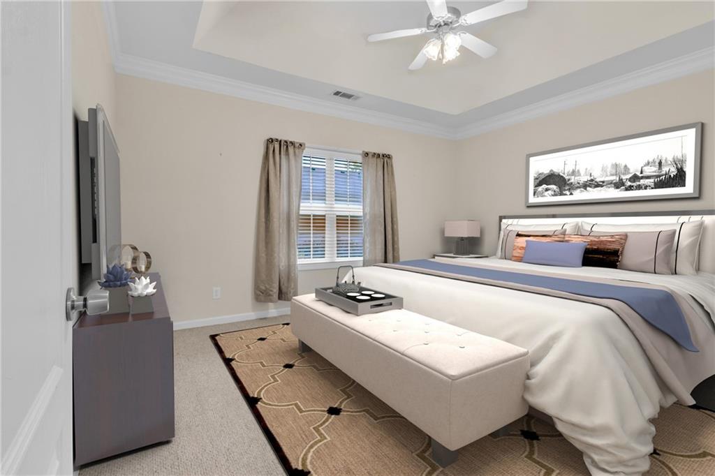 4557 Caleb Crossing, Unit 71 Powder Springs, GA 30127 - Photo 3 of 23 a bedroom with a bed and dresser with mirror