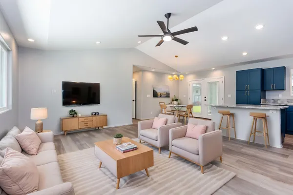 a living room with furniture and a flat screen tv