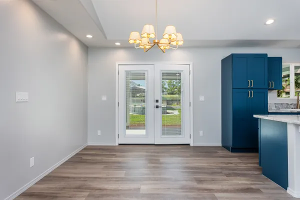 a view of an entryway with wooden floor