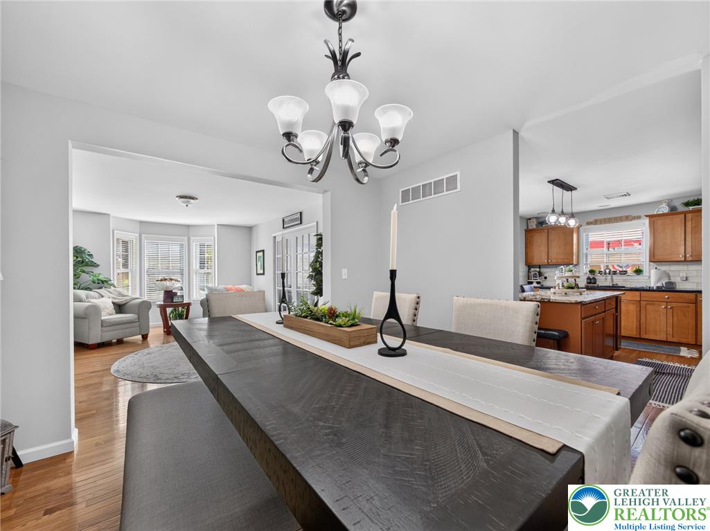 4148 Ross Road Bethlehem, PA 18020 - Photo 49 of 67 An inviting dining area offers a glimpse into both the living space and the kitchen.