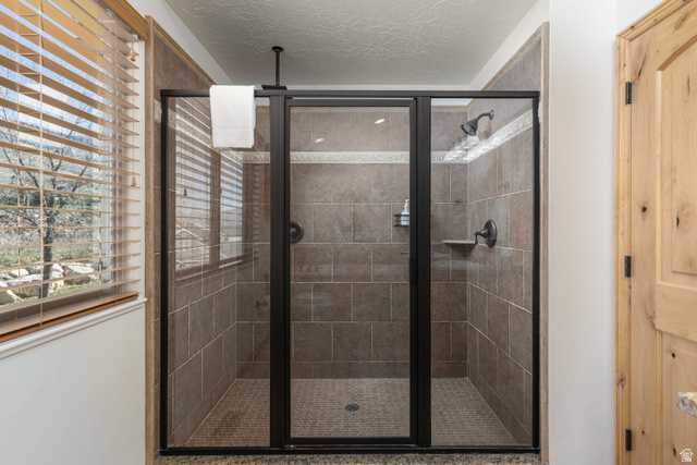 5168 Fairview Loop, Unit C604 Eden, UT 84310 - Photo 25 of 53 Full bath featuring a stall shower and a textured ceiling