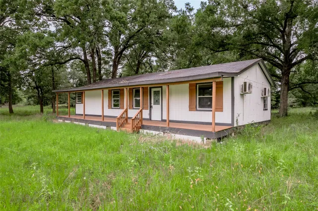 a backyard of a house with seating space