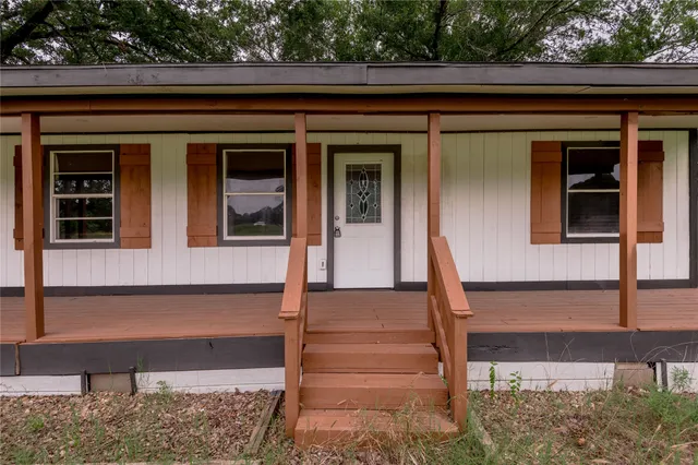 a front view of house with wooden floor