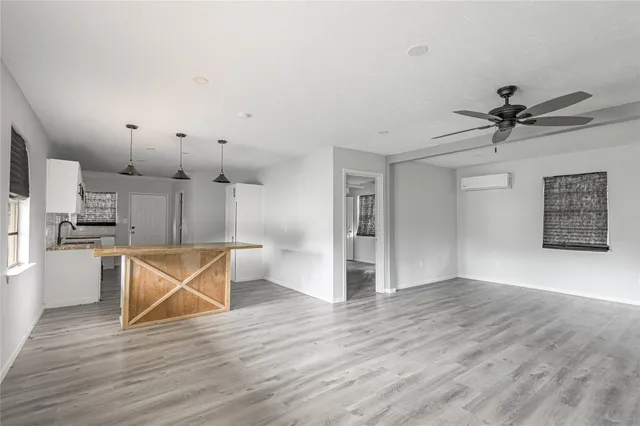 a view of kitchen with cabinets and wooden floor